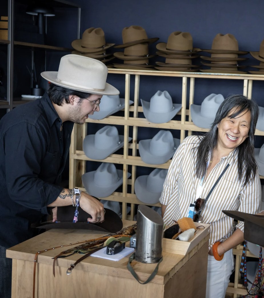 A guest's cowboy hat being hand-finished in the Genesis Club One shop